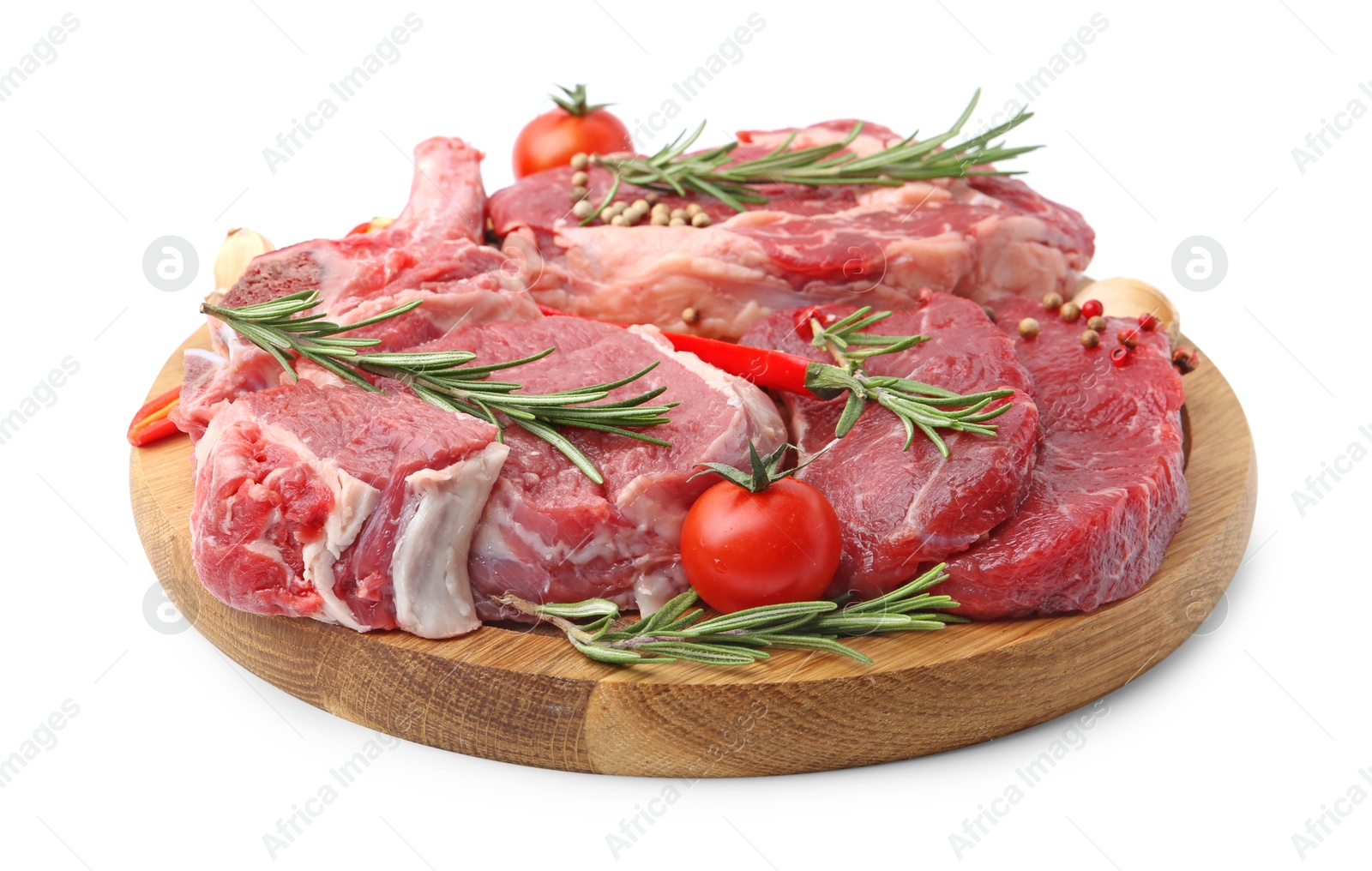 Photo of Pieces of raw beef meat, spices and tomatoes isolated on white