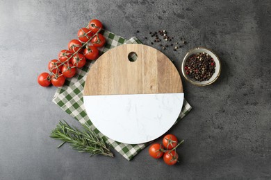 Photo of Cutting board with tomatoes and spices on grey table, flat lay