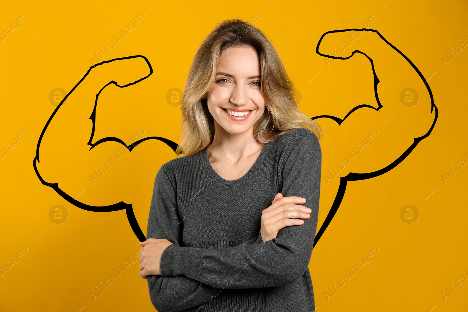 Image of Beautiful woman with drawing of strong arms behind her on orange background