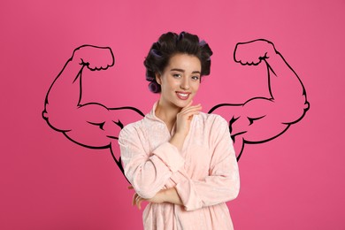 Image of Beautiful young woman with drawing of strong arms behind her on pink background