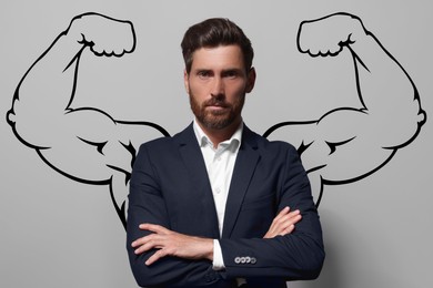 Image of Confident businessman with drawing of strong arms behind him on grey background