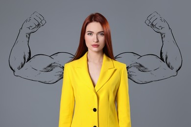 Image of Confident businesswoman with drawing of strong arms behind her on grey background