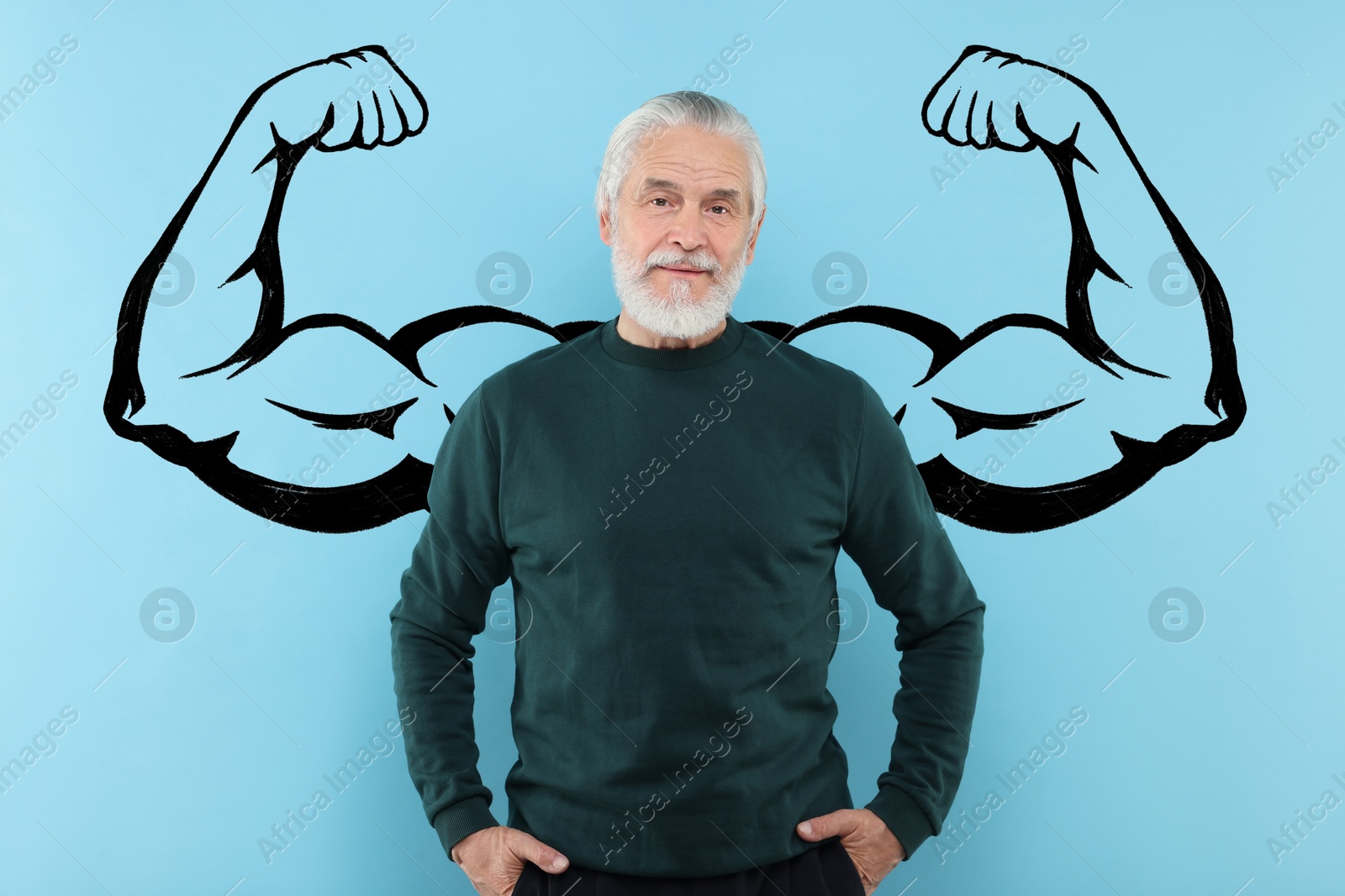 Image of Senior man with drawing of strong arms behind him on light blue background