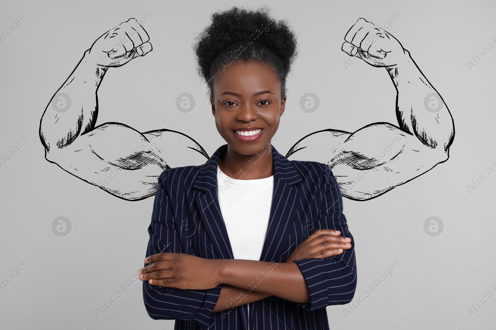 Image of Confident businesswoman with drawing of strong arms behind her on grey background