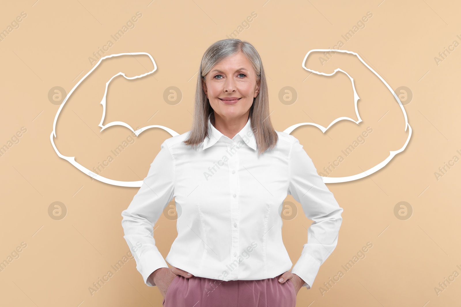 Image of Beautiful mature woman with drawing of strong arms behind her on beige background