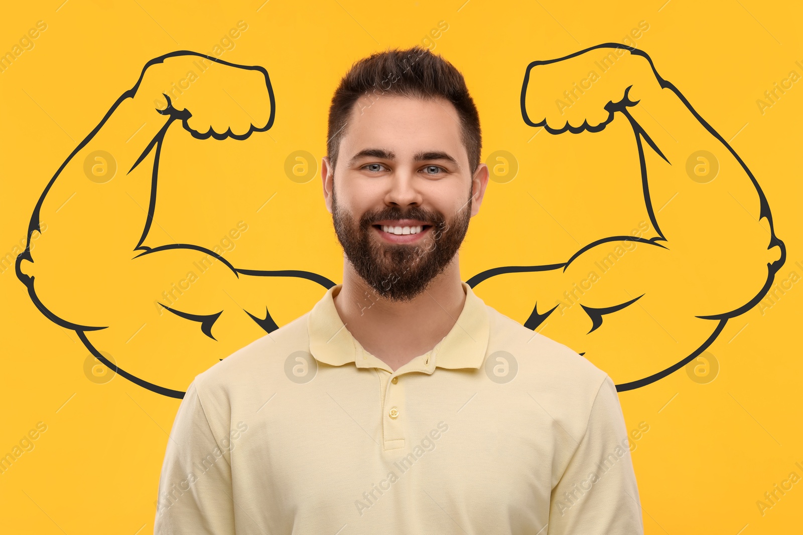 Image of Handsome young man with drawing of strong arms behind him on orange background