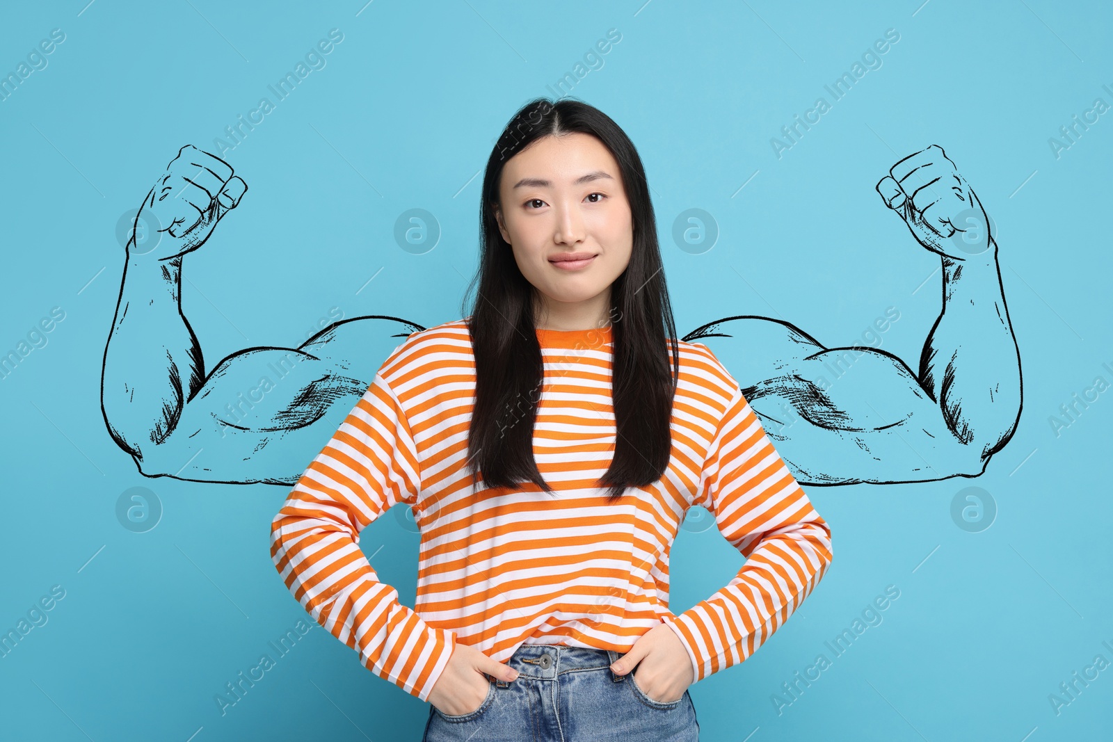 Image of Beautiful woman with drawing of strong arms behind her on light blue background