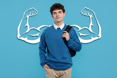 Handsome young man with drawing of strong arms behind him on light blue background