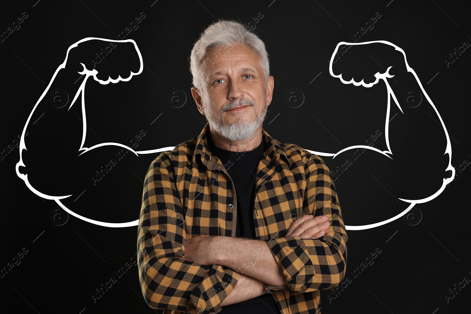 Image of Senior man with drawing of strong arms behind him on black background