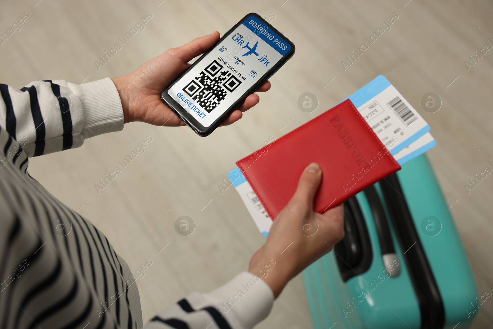 Image of Tourist with passport, flight tickets and mobile phone indoors, above view. Online ticket with QR code on device screen