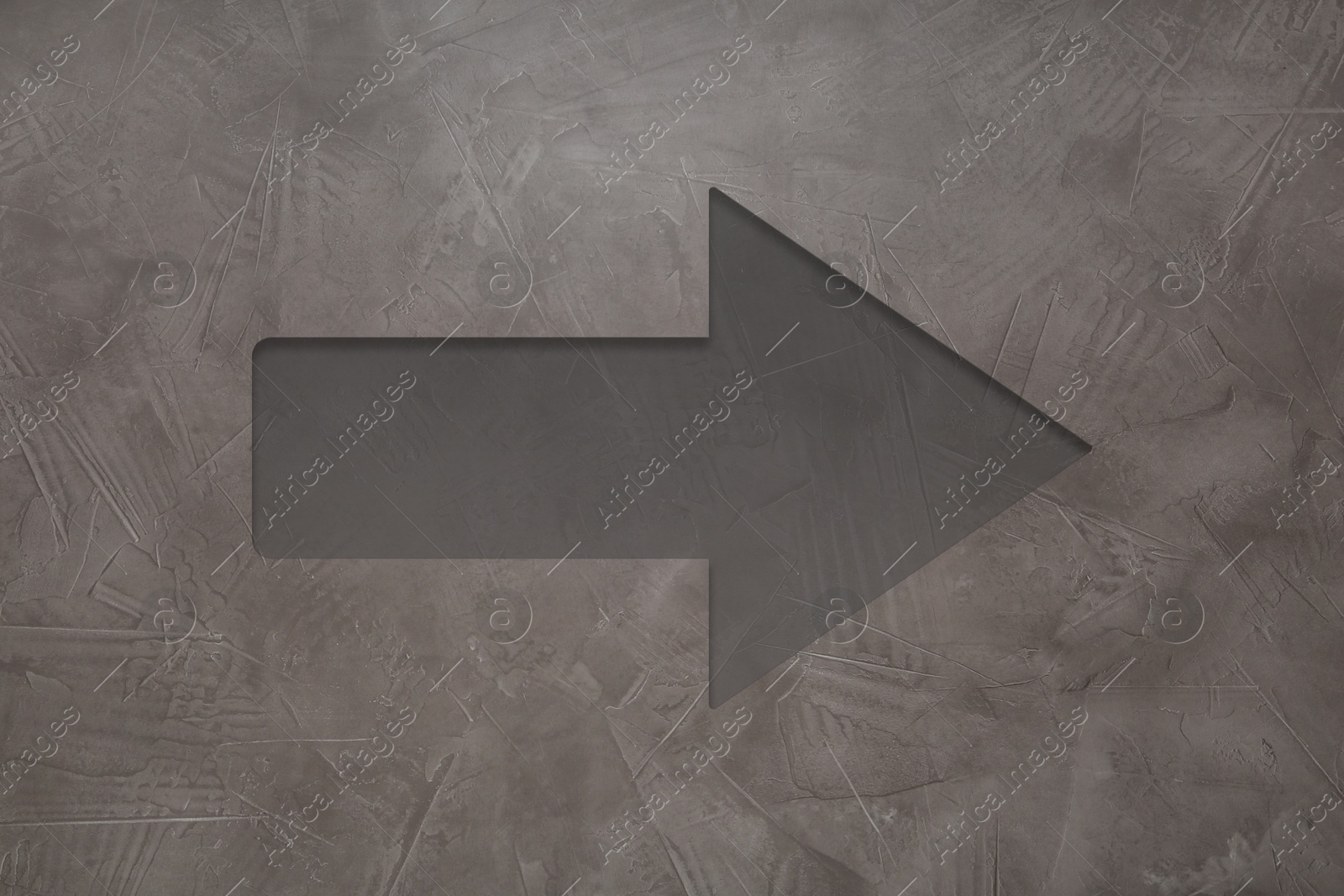 Image of One arrow on grey textured background. Pointer