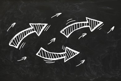 Image of Three white arrows on black chalkboard. Pointer