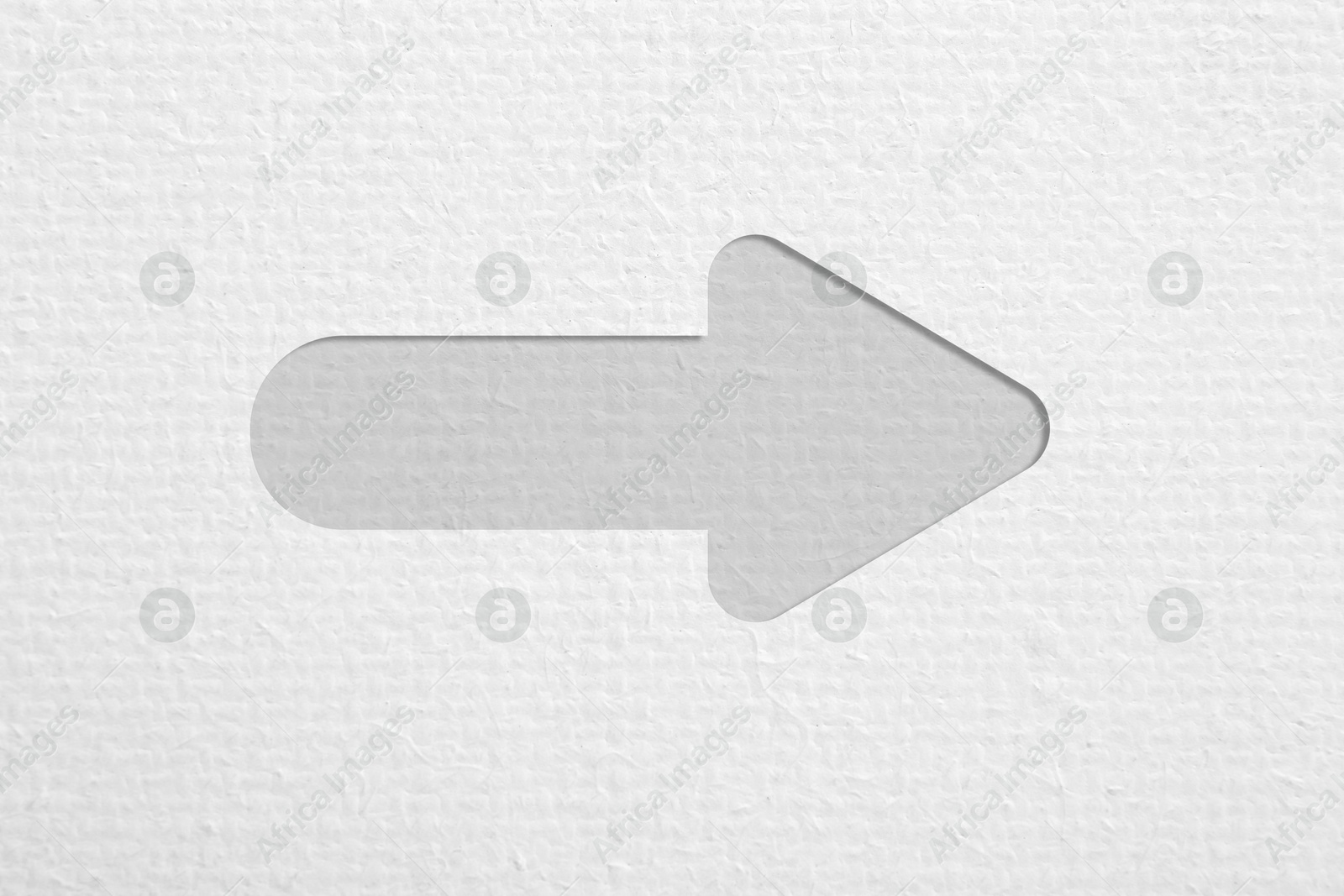 Image of One arrow on white textured background. Pointer