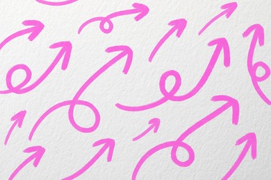 Image of Many pink arrows on white textured background. Pointer