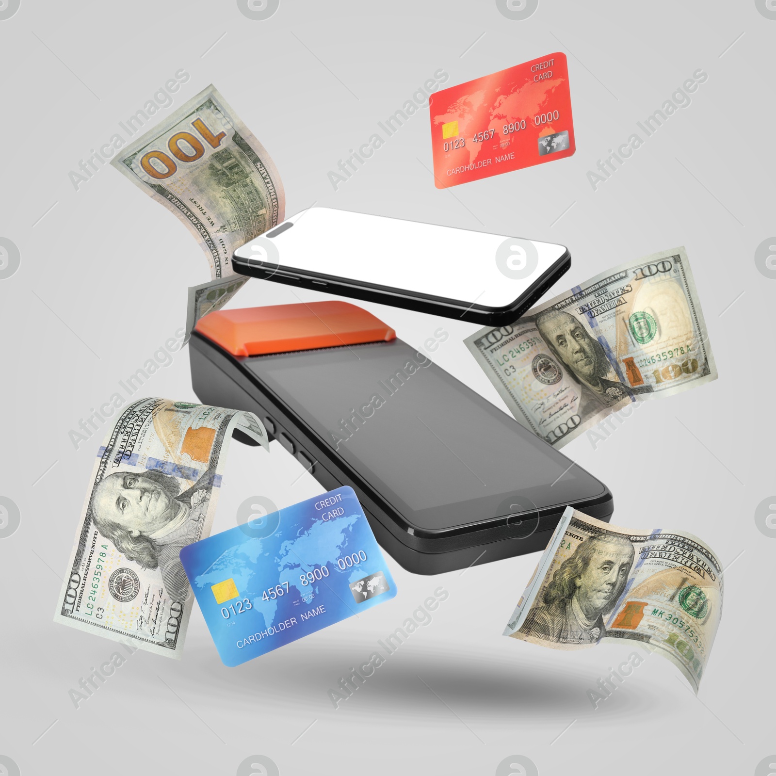 Image of Payment terminal, bank cards, dollars and mobile phone in air on grey background