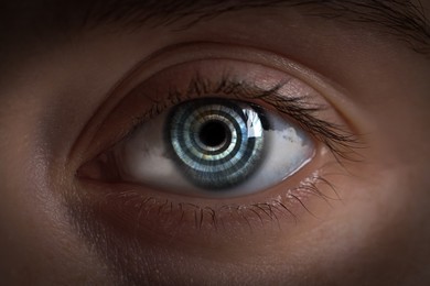 Image of Hypnosis. Hypnotic spiral and clouds in woman's eye, closeup