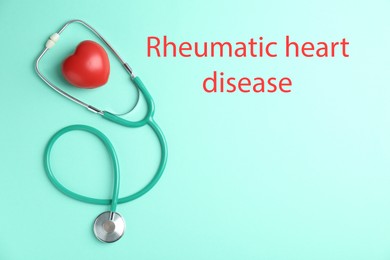 Image of Rheumatism. Stethoscope, red heart and words Rheumatic Heart Disease on turquoise background, top view