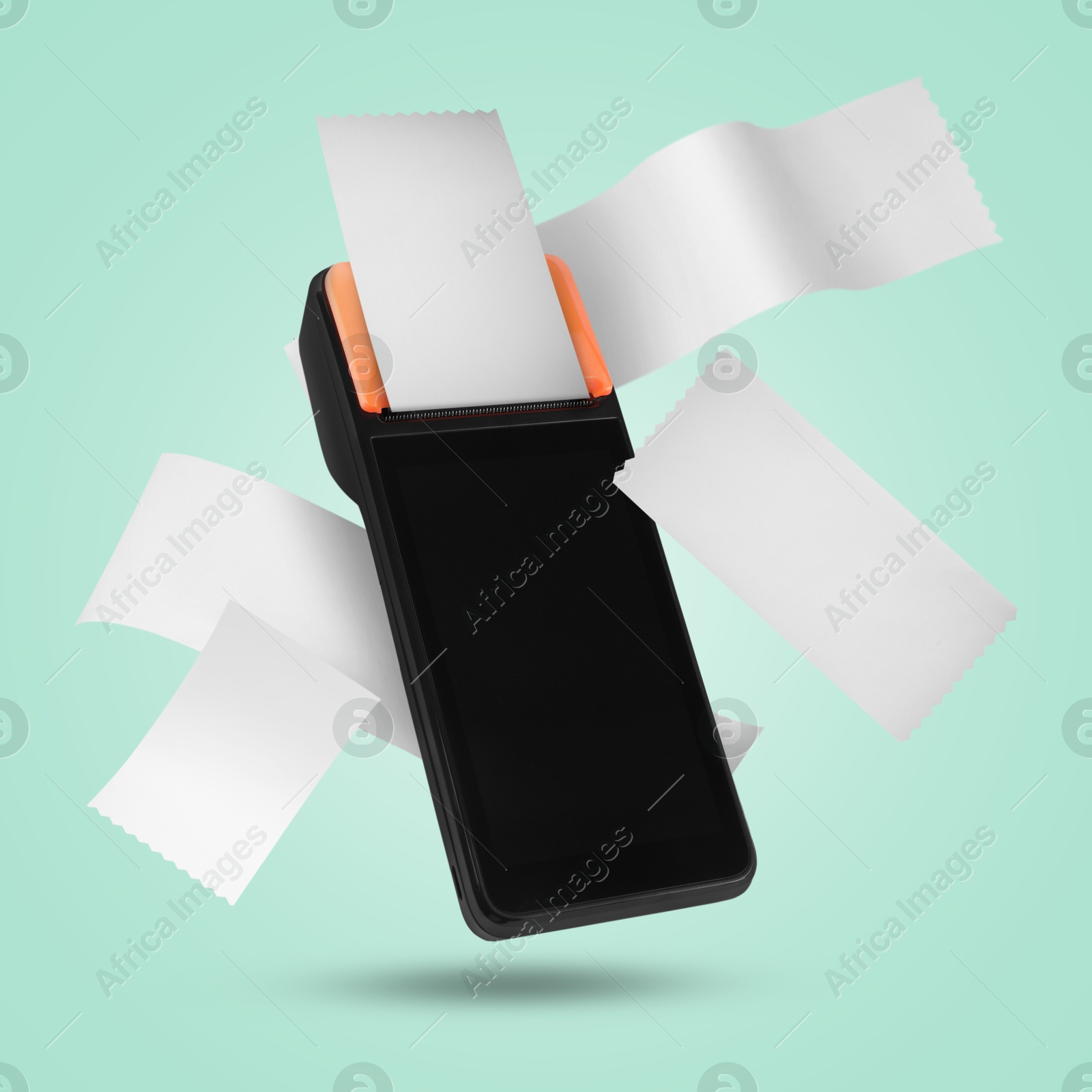 Image of Payment terminal and receipts in air on turquoise background