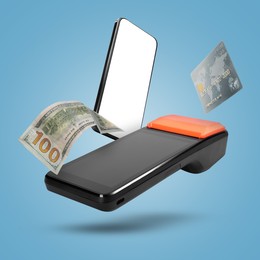 Image of Payment terminal, bank card, dollar and mobile phone in air on pastel blue background