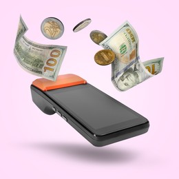 Image of Payment terminal, dollars and coins in air on pink background