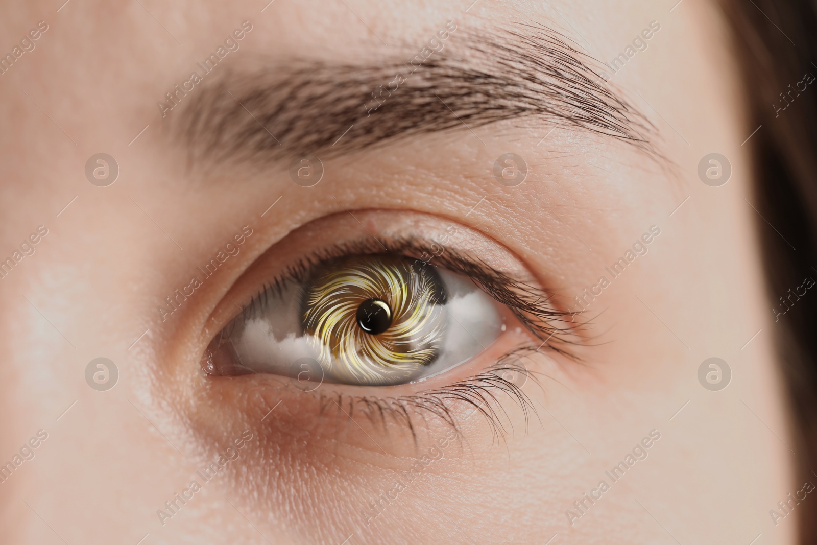 Image of Hypnosis. Hypnotic spiral and clouds in woman's eye, closeup