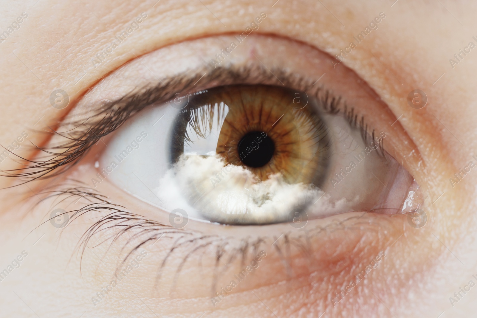 Image of Hypnosis. Hypnotic cloud in woman's eye, closeup