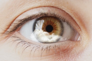 Hypnosis. Hypnotic cloud in woman's eye, closeup