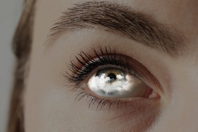 Image of Hypnosis. Hypnotic cloud in woman's eye, closeup