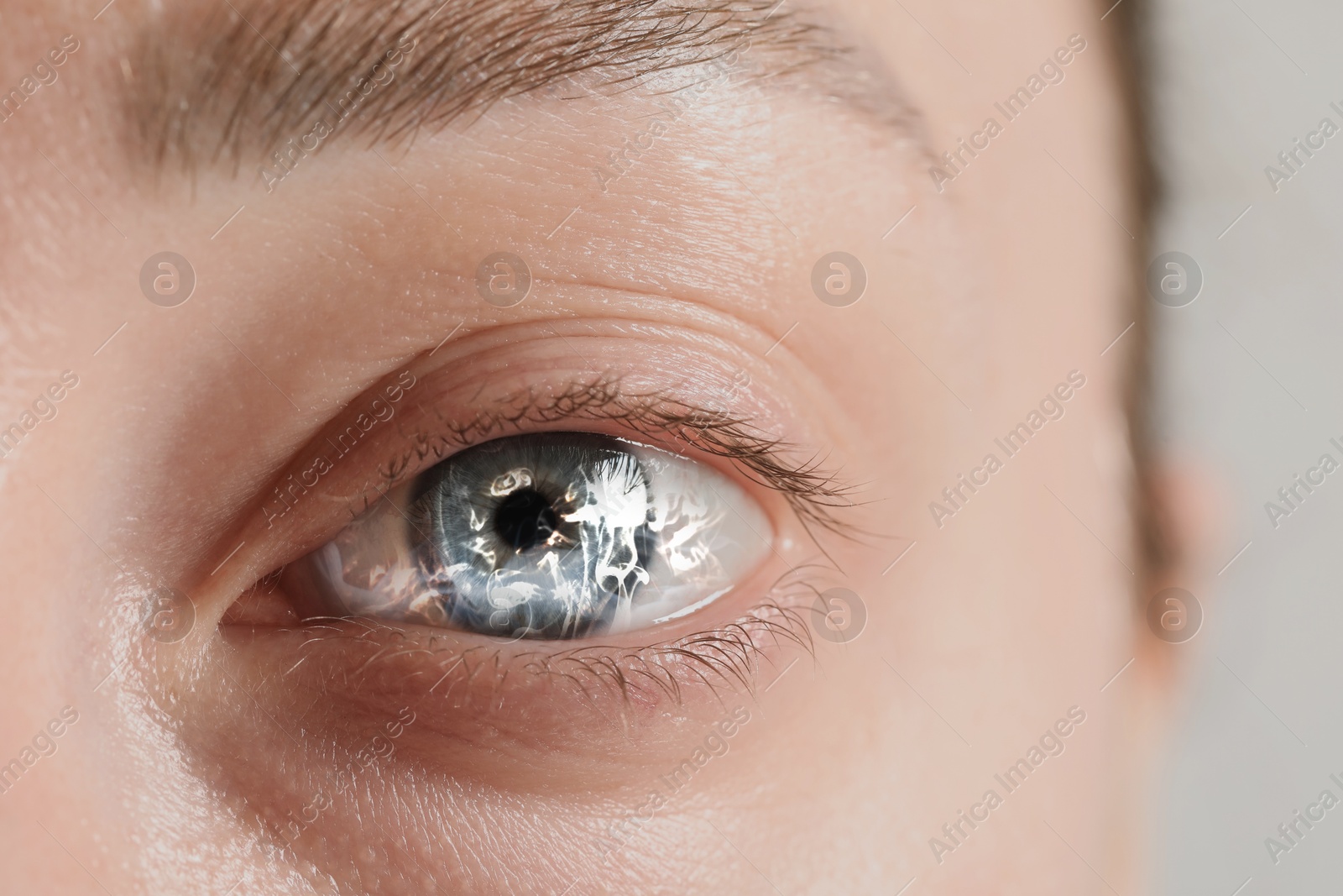 Image of Hypnosis. Hypnotic smoke in woman's eye, closeup