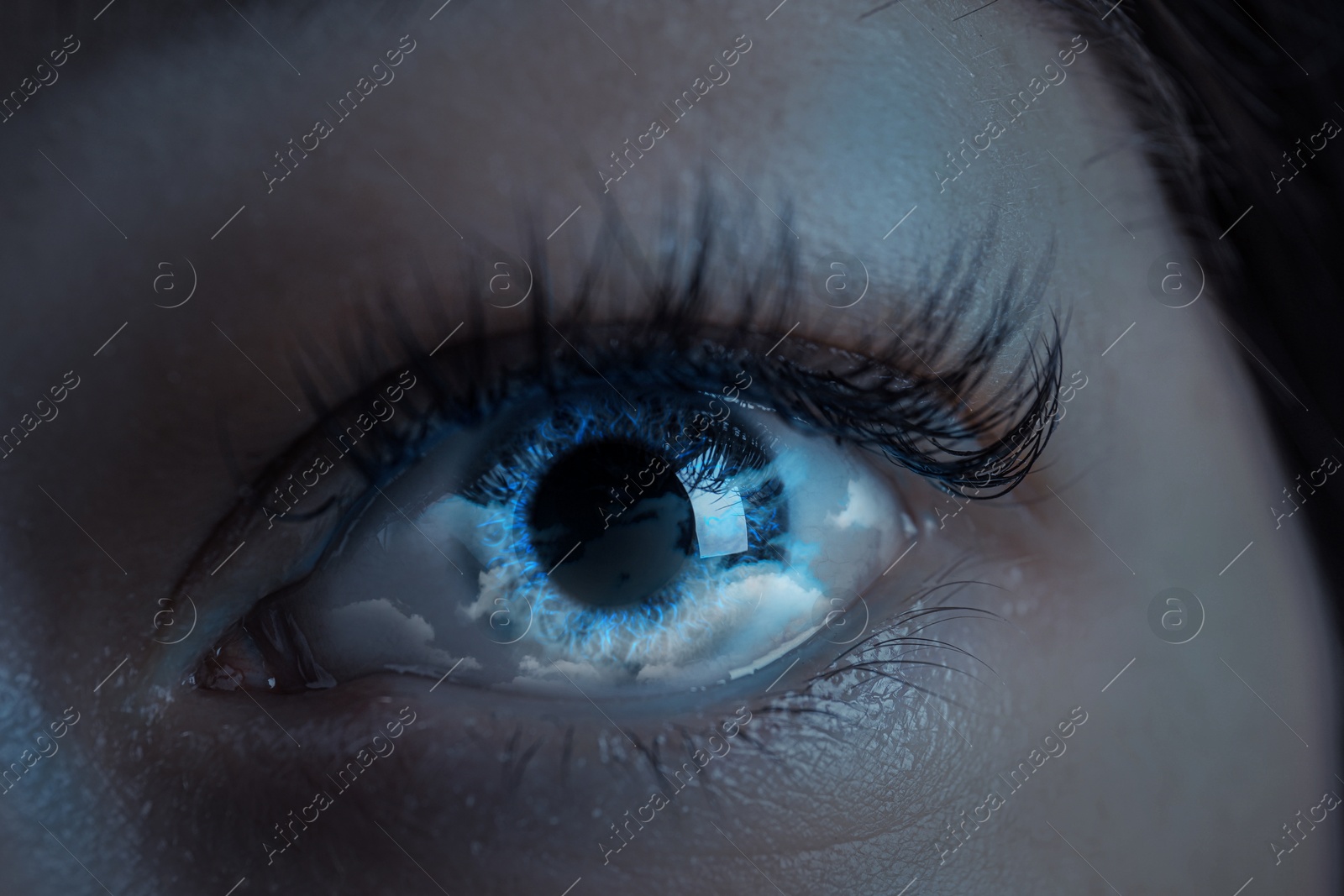 Image of Hypnosis. Hypnotic clouds in woman's eye, closeup