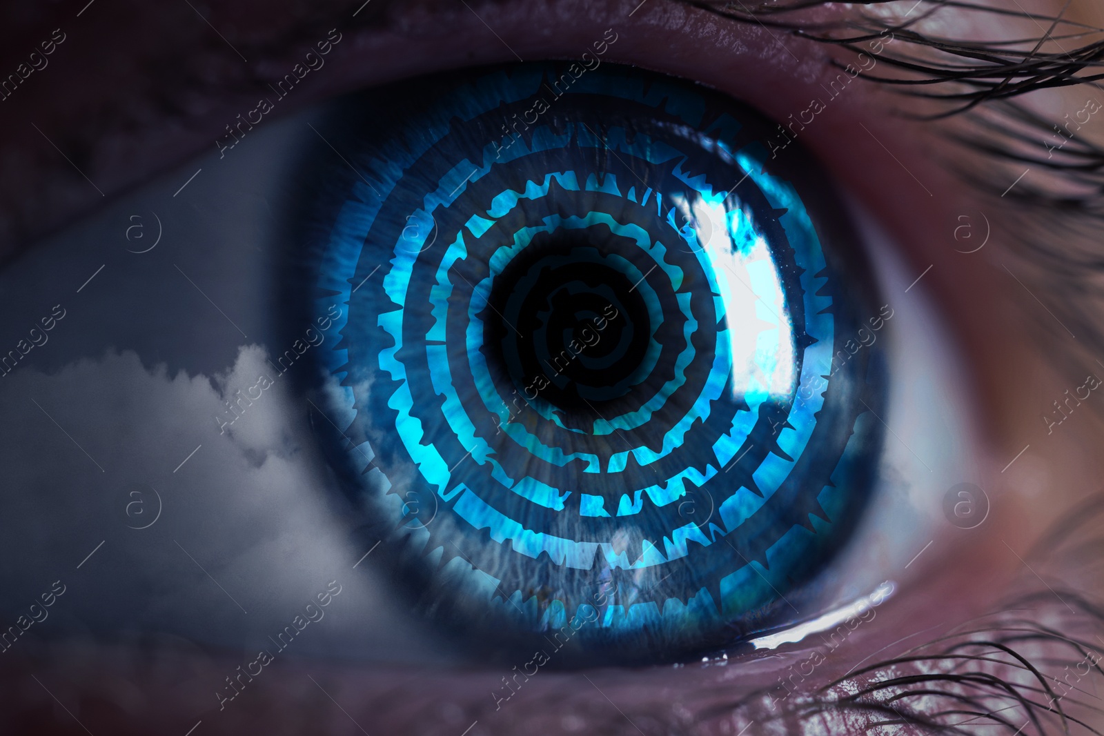 Image of Hypnosis. Hypnotic spiral and clouds in woman's eye, closeup