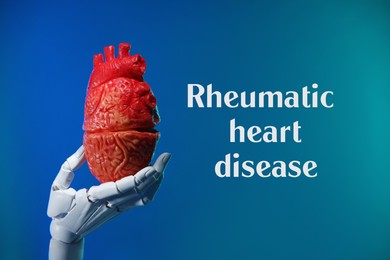 Image of Rheumatism. Robot hand holding model of human heart on blue gradient background with words Rheumatic Heart Disease