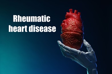 Image of Rheumatism. Robot hand holding model of human heart on blue gradient background with words Rheumatic Heart Disease