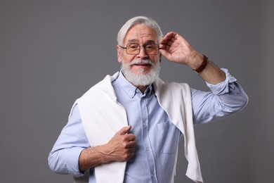 Photo of Portrait of stylish bearded man on grey background