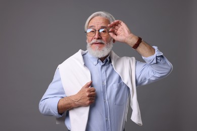 Photo of Portrait of stylish bearded man on grey background