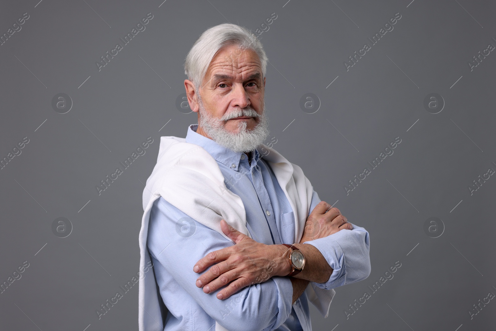 Photo of Portrait of stylish bearded man on grey background