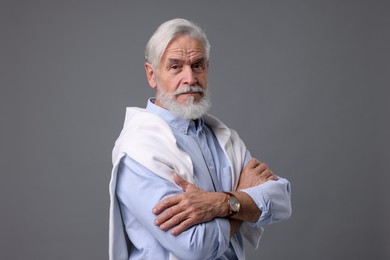 Photo of Portrait of stylish bearded man on grey background