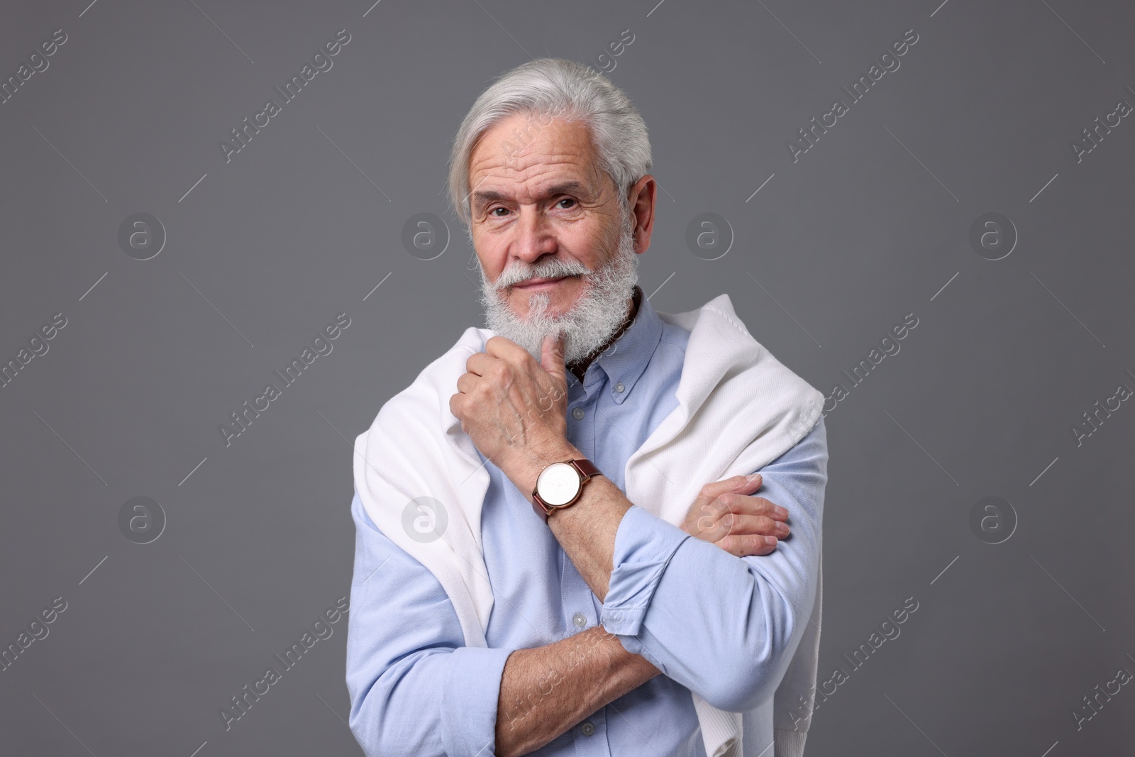 Photo of Portrait of stylish bearded man on grey background