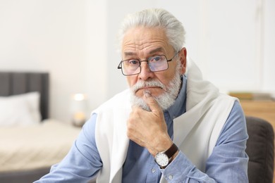 Photo of Portrait of handsome bearded man at home