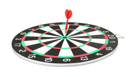 Photo of Dart board with red arrow hitting target isolated on white