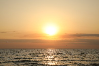 Photo of Beautiful view of sky over sea at sunset