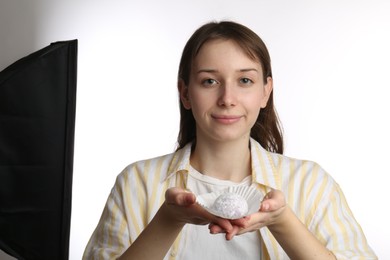 Photo of Beautiful woman with tasty mochi on white background