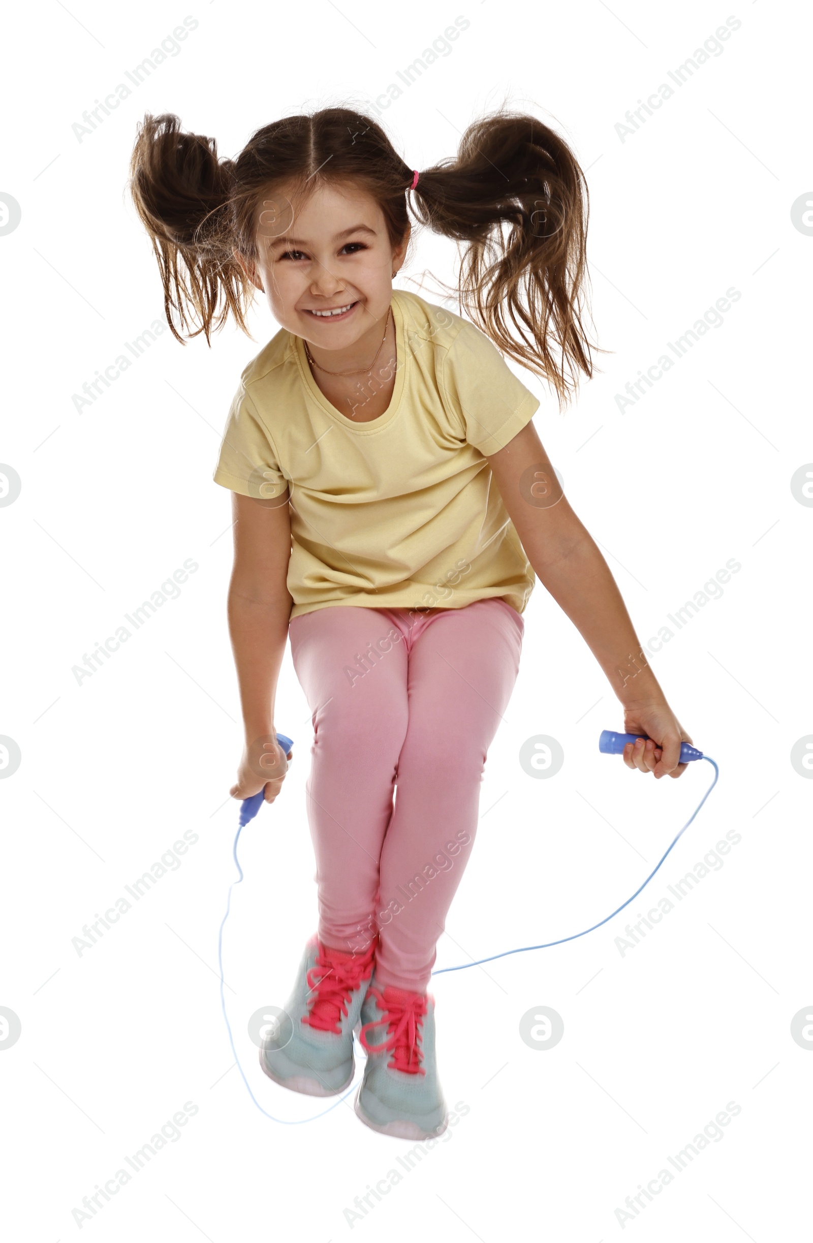 Photo of Cute little girl with jump rope on white background