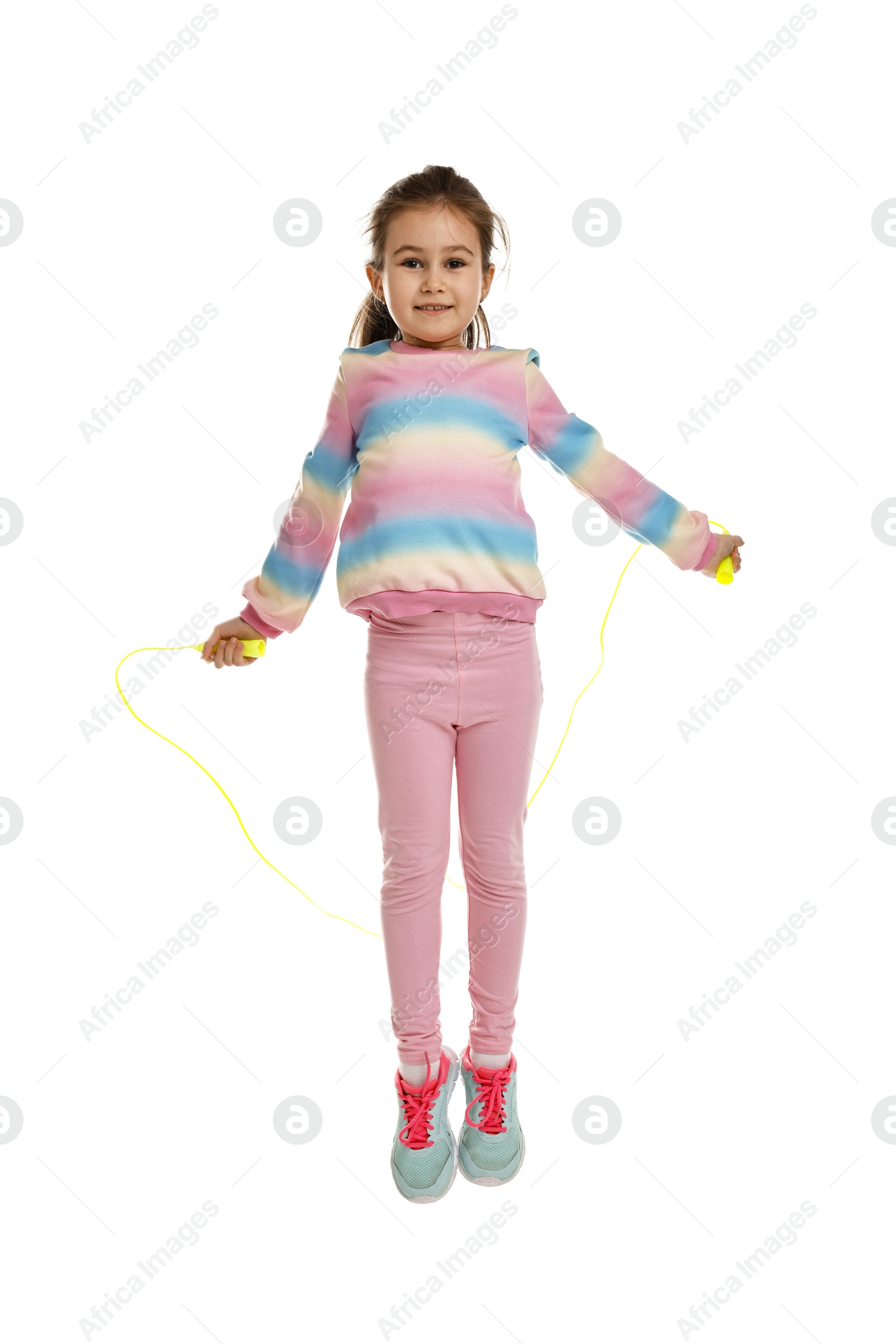 Photo of Cute little girl with jump rope on white background