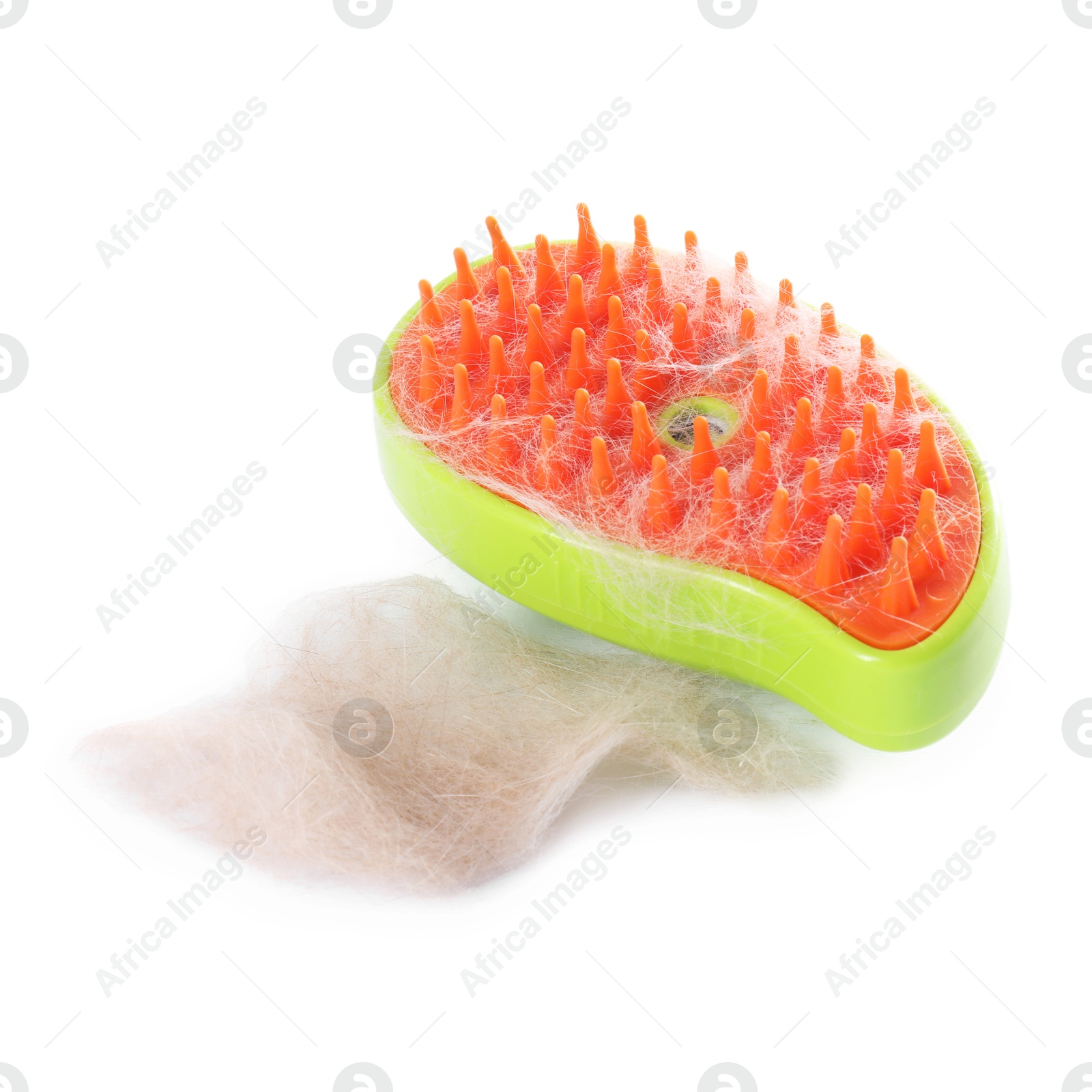 Photo of Grooming brush and pile of pet's hair isolated on white