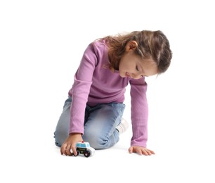 Photo of Little girl playing with toy car on white background