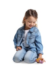 Photo of Little girl playing with toy car on white background