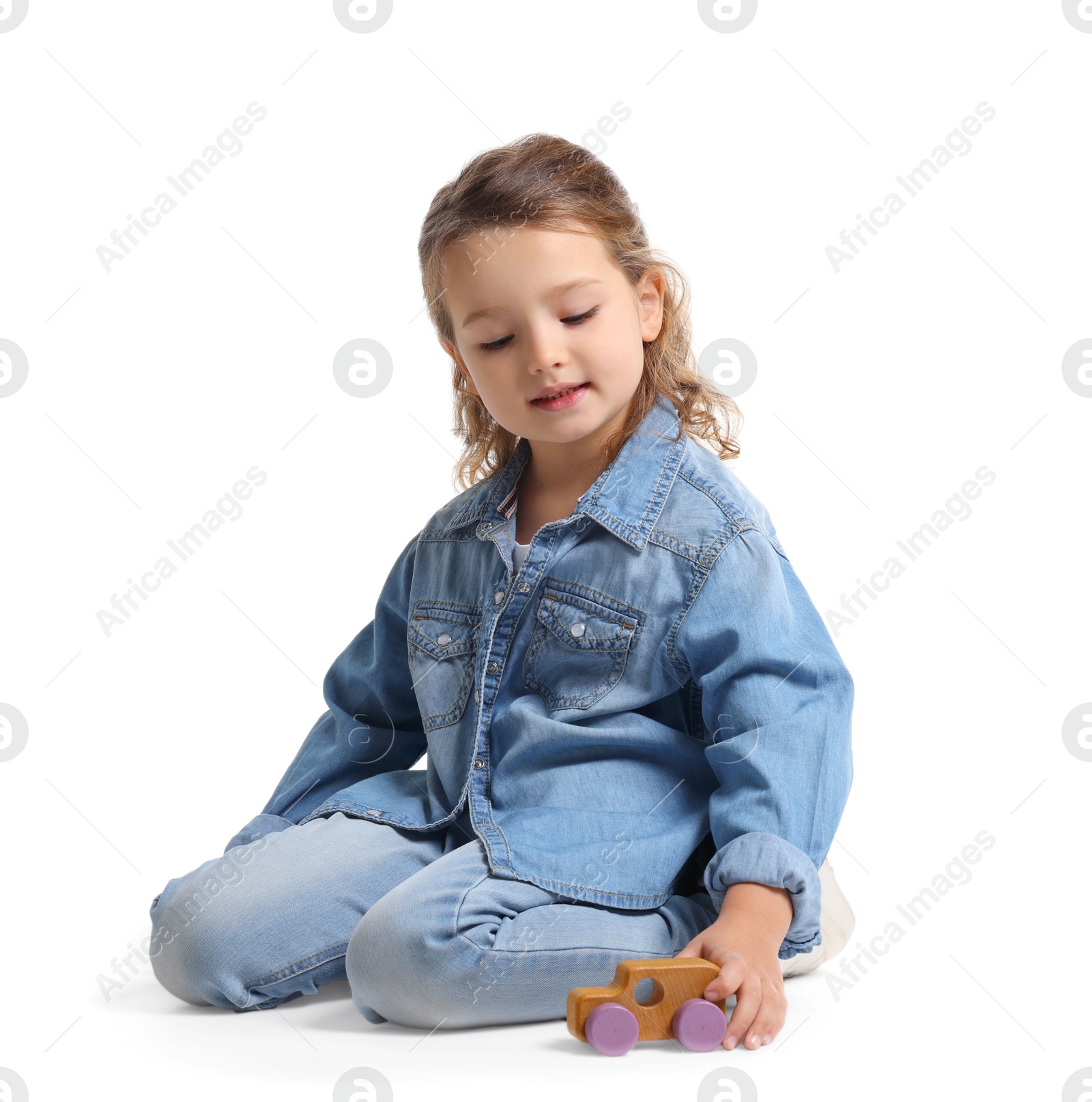 Photo of Little girl playing with toy car on white background