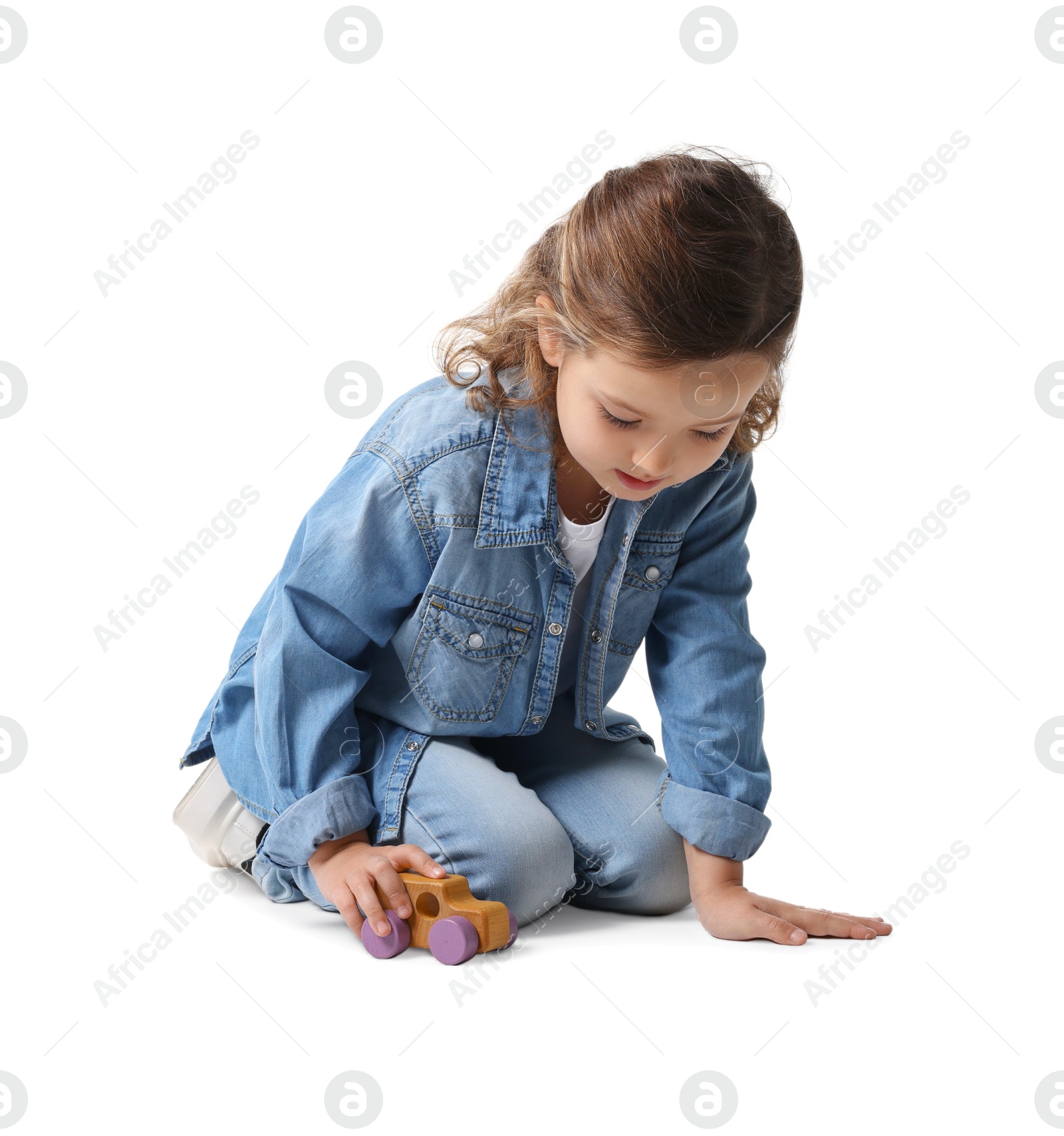 Photo of Little girl playing with toy car on white background