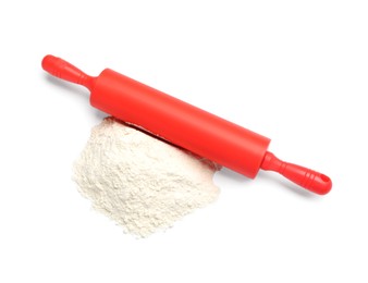 Photo of Red rolling pin and flour isolated on white, top view